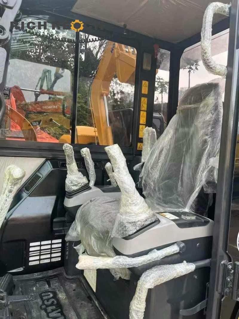 Undercarriage and tracks of a 2017 Komatsu PC56-7 excavator with 1,900 hours, priced at $11,111
